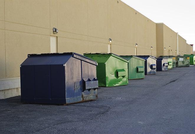 large construction dumpster positioned on a city street in Gautier MS